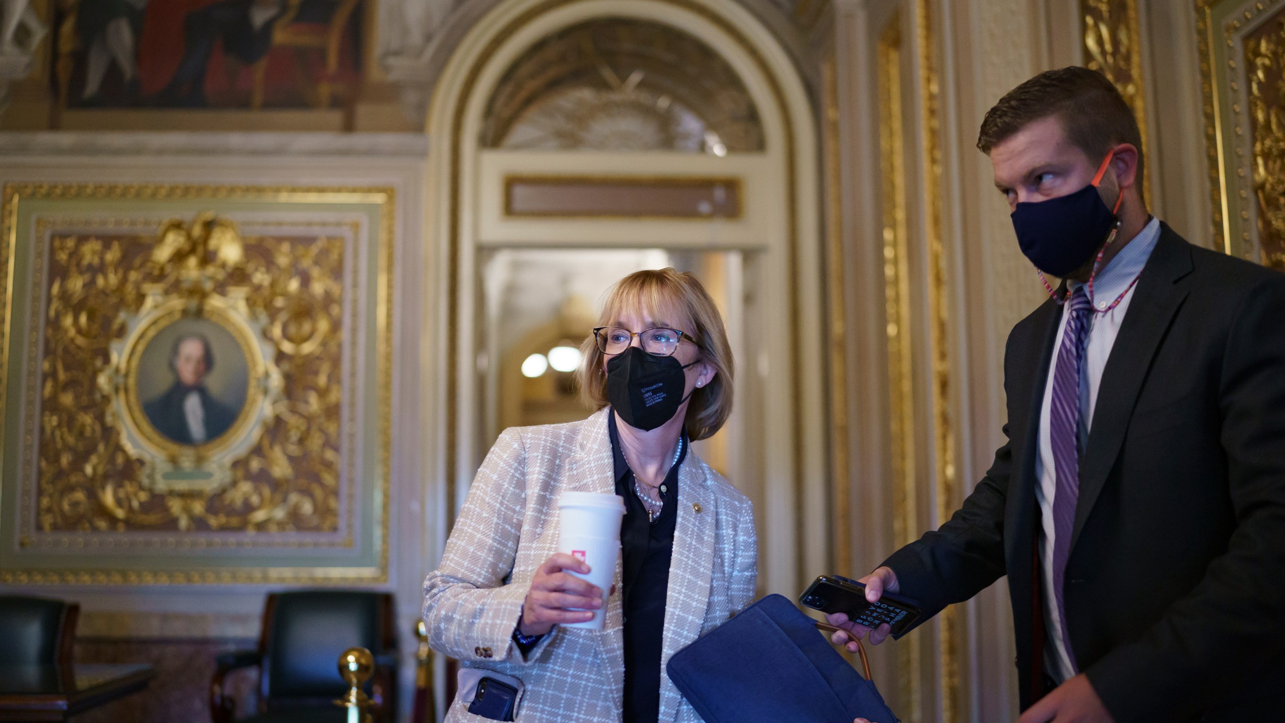 Sen. Maggie Hassan, D-N.H., arrives at the Capitol as the Senate convenes for a rare weekend session on the $1 trillion bipartisan infrastructure bill, at the Capitol in Washington, Saturday, Aug. 7, 2021. (AP Photo/J. Scott Applewhite)