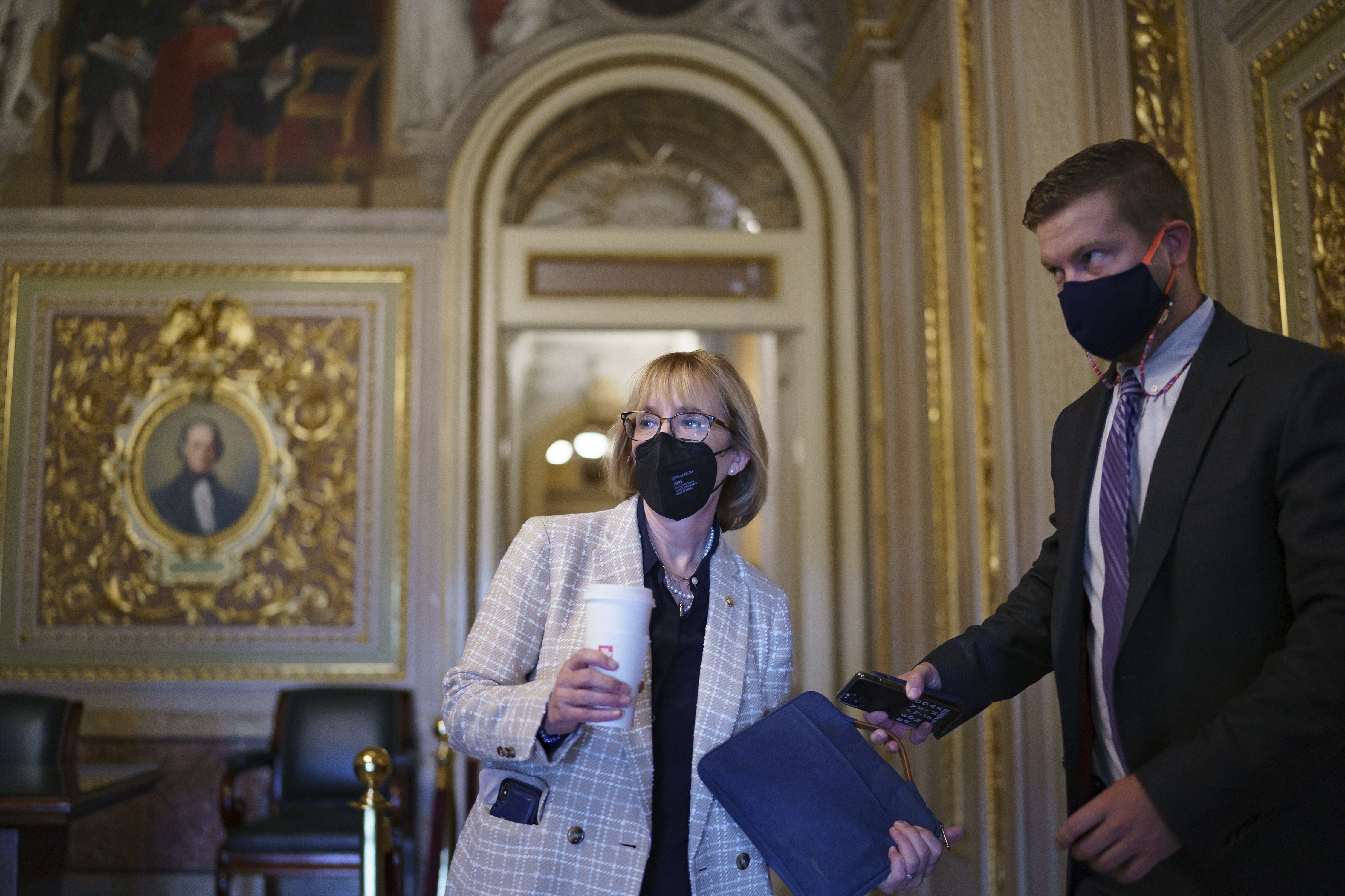 Sen. Maggie Hassan, D-N.H., arrives at the Capitol as the Senate convenes for a rare weekend session on the $1 trillion bipartisan infrastructure bill, at the Capitol in Washington, Saturday, Aug. 7, 2021. (AP Photo/J. Scott Applewhite)