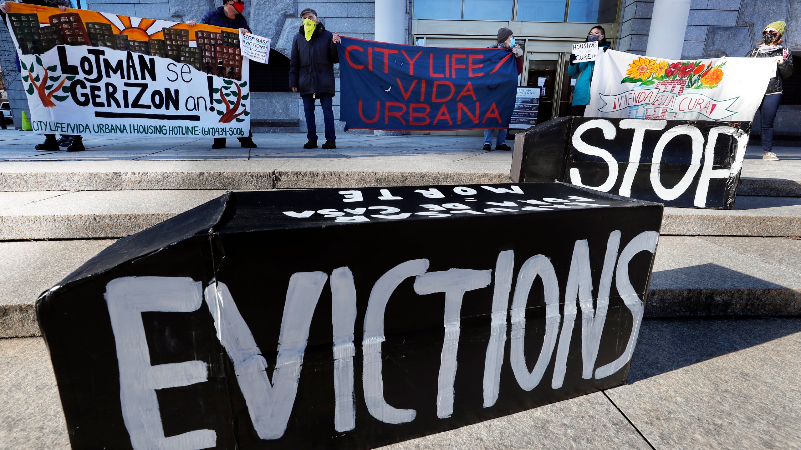 In this Jan. 13, 2021, file photo, tenants' rights advocates demonstrate in front of the Edward W. Brooke Courthouse in Boston. A federal judge is refusing landlords' request to put the Biden administration’s new eviction moratorium on hold, though she made clear she thinks it's illegal. U.S. District Judge Dabney Friedrich on Friday, Aug. 13, said her “hands are tied” by an appellate ruling the last time courts considered the evictions moratorium in the spring. (AP Photo/Michael Dwyer, File)