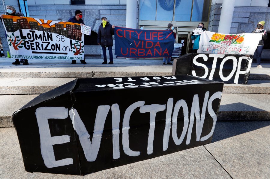 In this Jan. 13, 2021, file photo, tenants' rights advocates demonstrate in front of the Edward W. Brooke Courthouse in Boston. A federal judge is refusing landlords' request to put the Biden administration’s new eviction moratorium on hold, though she made clear she thinks it's illegal. U.S. District Judge Dabney Friedrich on Friday, Aug. 13, said her “hands are tied” by an appellate ruling the last time courts considered the evictions moratorium in the spring. (AP Photo/Michael Dwyer, File)