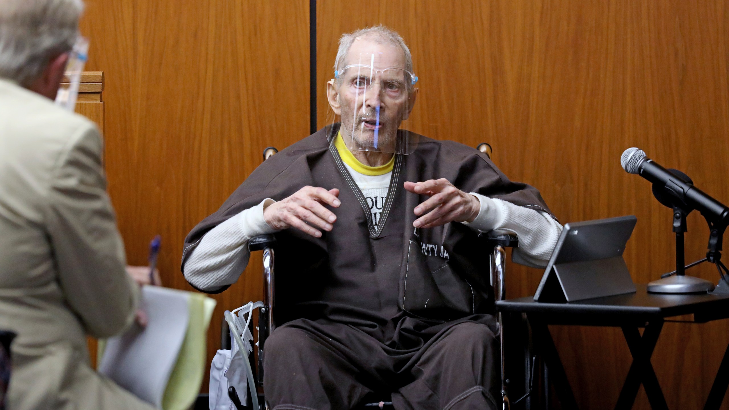 New York real estate scion Robert Durst, 78, answers questions from defense attorney Dick DeGuerin, left, while testifying in his murder trial at the Inglewood Courthouse on Aug. 9, 2021. (Gary Coronado / Los Angeles Times)