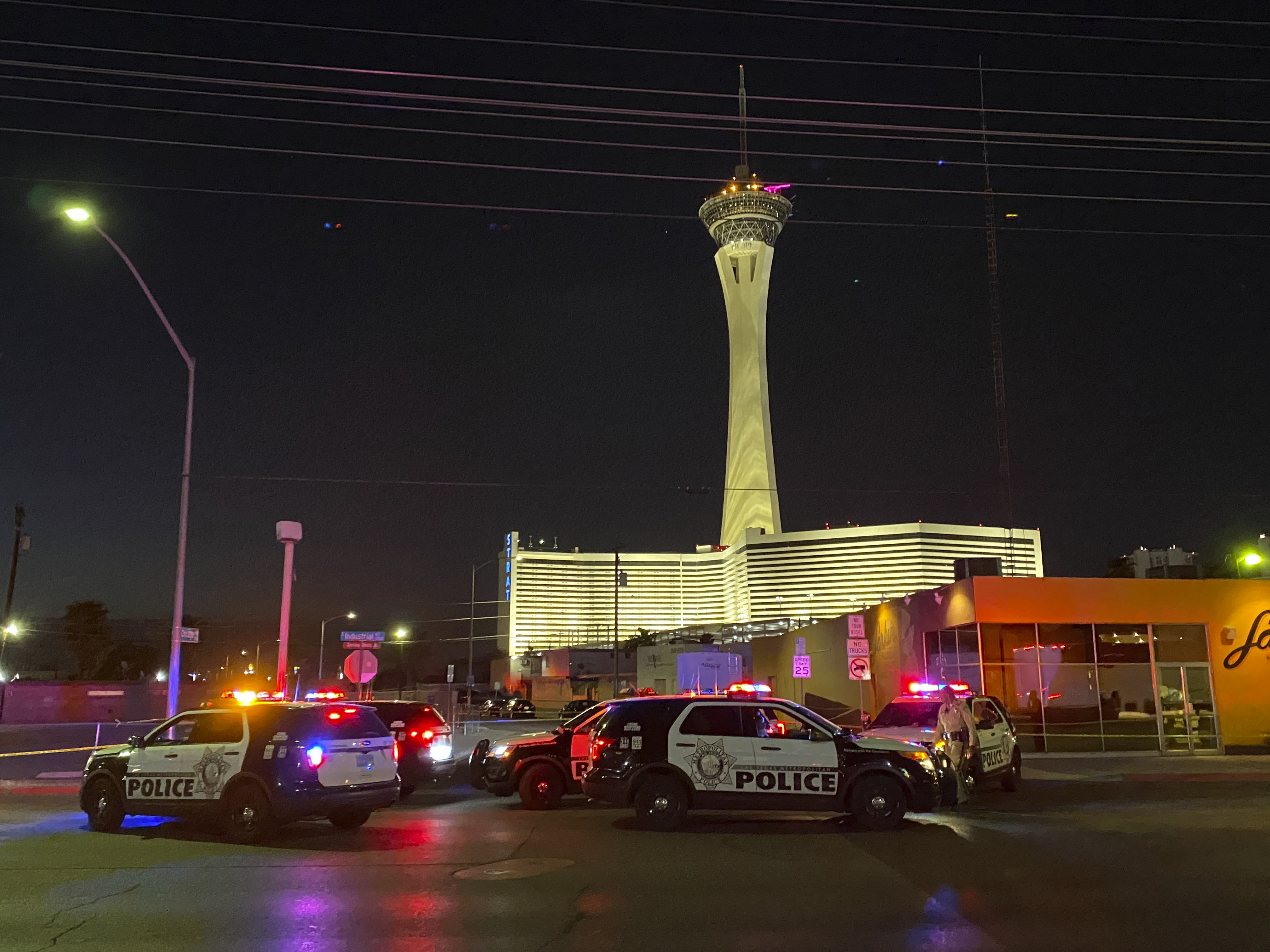 Las Vegas police investigate a shooting on Chicago Avenue in Las Vegas, Tuesday, Aug. 10, 2021. The shooting, apparently involving a landlord-tenant dispute, left two renters dead, one critically wounded with nine gunshot wounds and their landlord in custody as the suspect, Las Vegas police said Tuesday. (Glenn Puit/Las Vegas Review-Journal via AP)