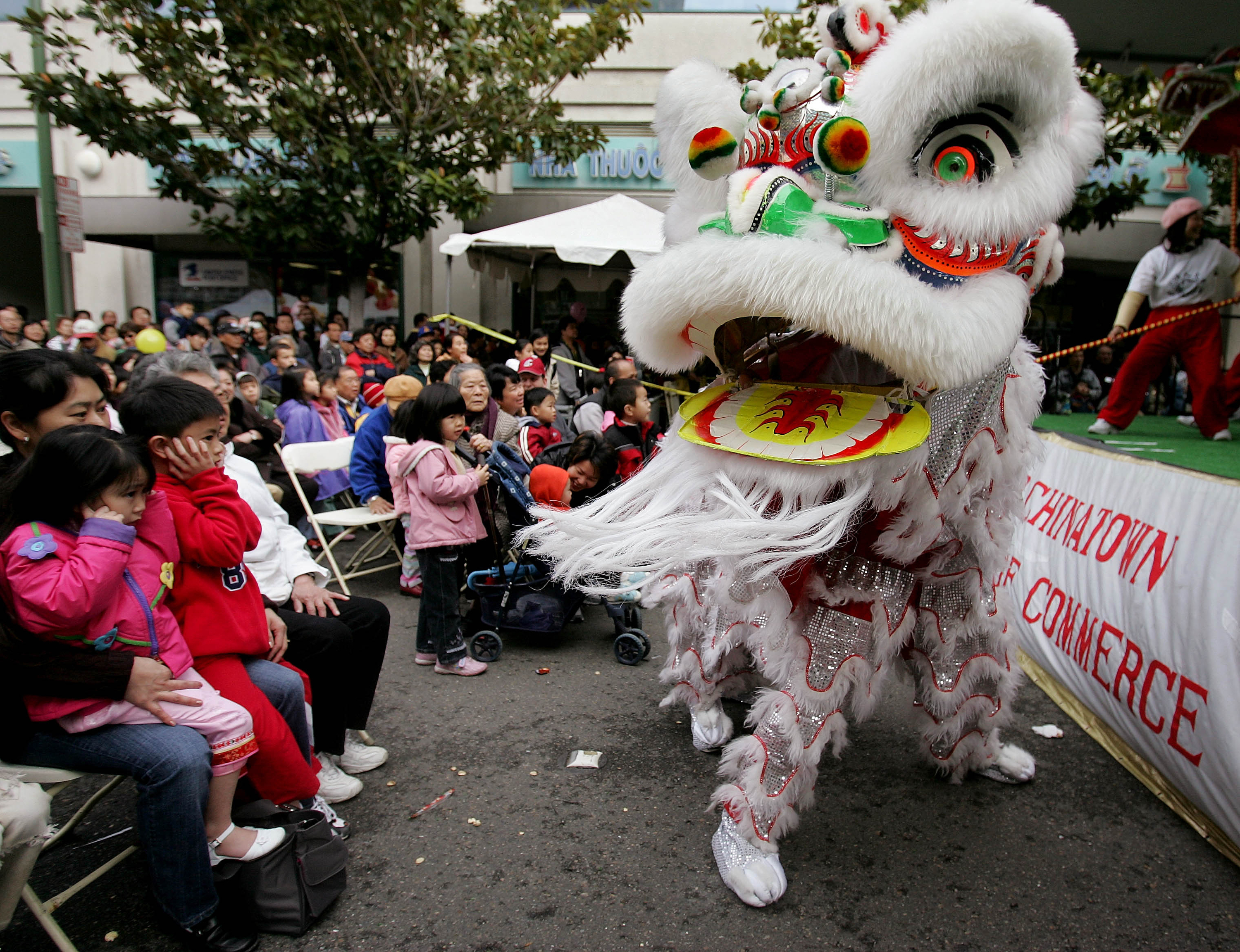 In this Jan. 21, 2006, file photo, Chinese lion dancers perform in Oakland's Chinatown in Oakland, Calif. (AP Photo/Paul Sakuma, File)