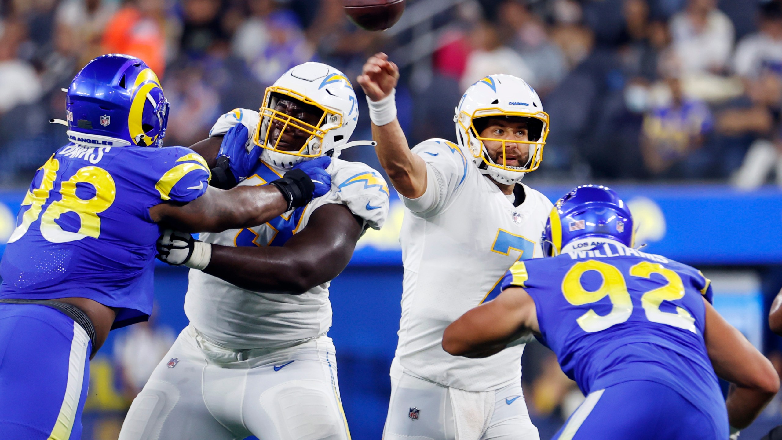 Los Angeles Chargers quarterback Chase Daniel (7) throws a pass against the Los Angeles Rams during the first half of a preseason NFL football game Saturday, Aug. 14, 2021, in Inglewood, Calif. (AP Photo/Ringo H.W. Chiu)