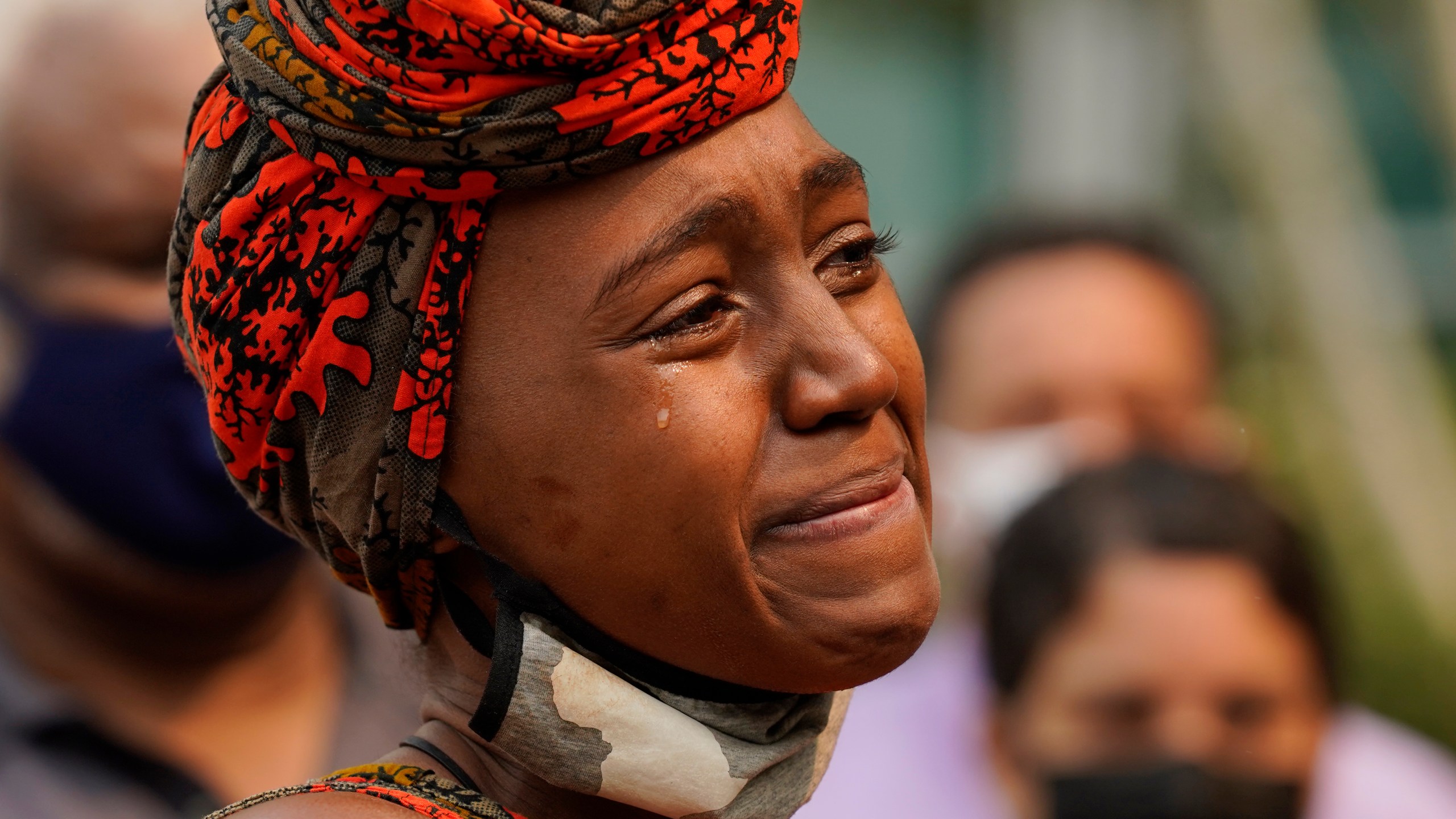 A tear streams down Nakia Porter’s cheek during a news conference in Sacramento to announce the filing of a federal lawsuit she has brought against two Solano County Sheriff's deputies on Aug. 18, 2021. (Rich Pedroncelli / Associated Press)