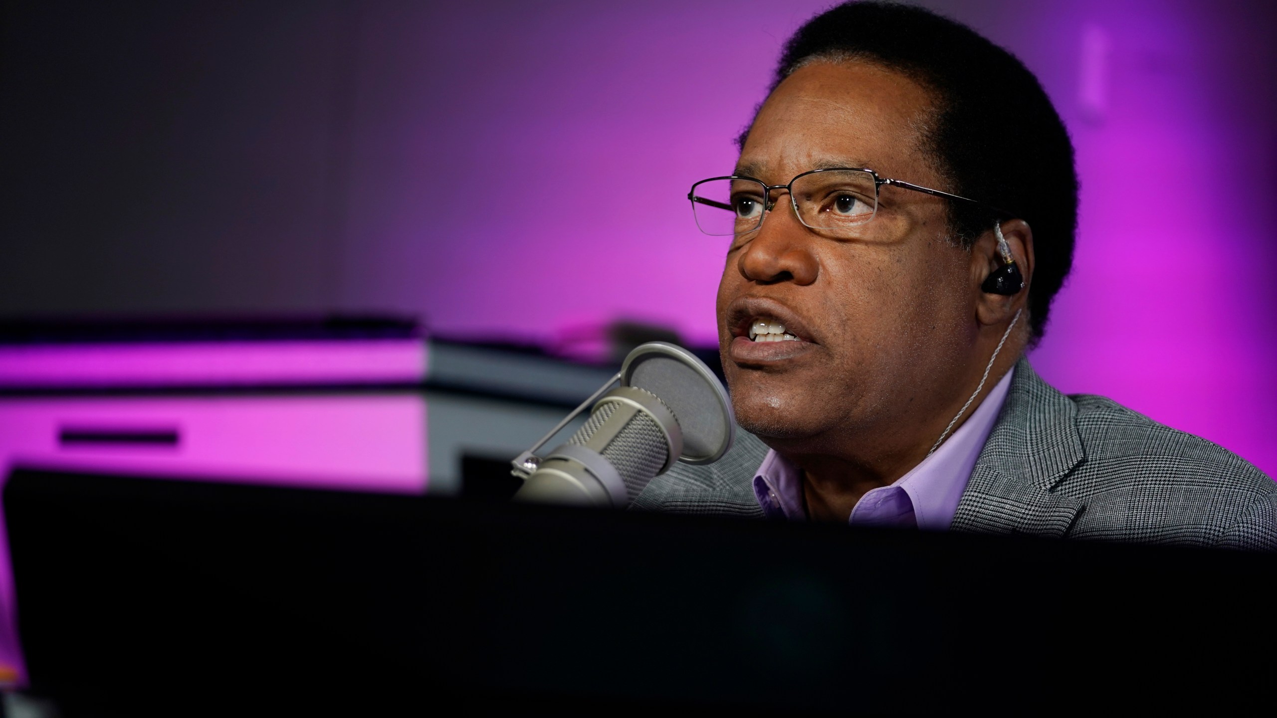 In this July 12, 2021 file photo radio talk show host Larry Elder speaks during his show, in Burbank, Calif. Alexandra Datig, Elder's former fiancee said Thursday, Aug. 19 that Elder, a candidate for governor in the Sept. 14 recall election, once displayed a gun to her during a heated argument in 2015. Elder said he never brandished a gun at anyone. (AP Photo/Marcio Jose Sanchez, File)