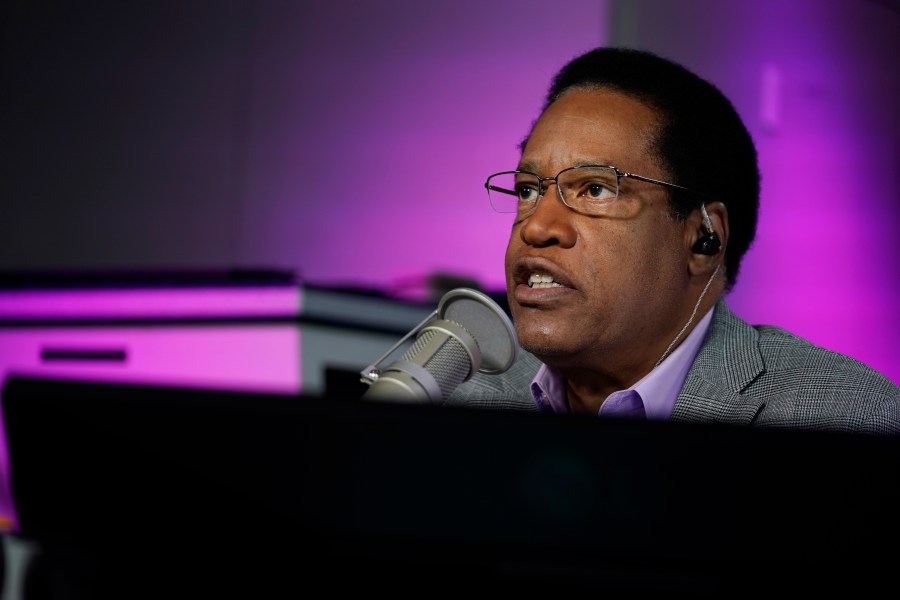 In this July 12, 2021 file photo radio talk show host Larry Elder speaks during his show, in Burbank, Calif. Alexandra Datig, Elder's former fiancee said Thursday, Aug. 19 that Elder, a candidate for governor in the Sept. 14 recall election, once displayed a gun to her during a heated argument in 2015. Elder said he never brandished a gun at anyone. (AP Photo/Marcio Jose Sanchez, File)