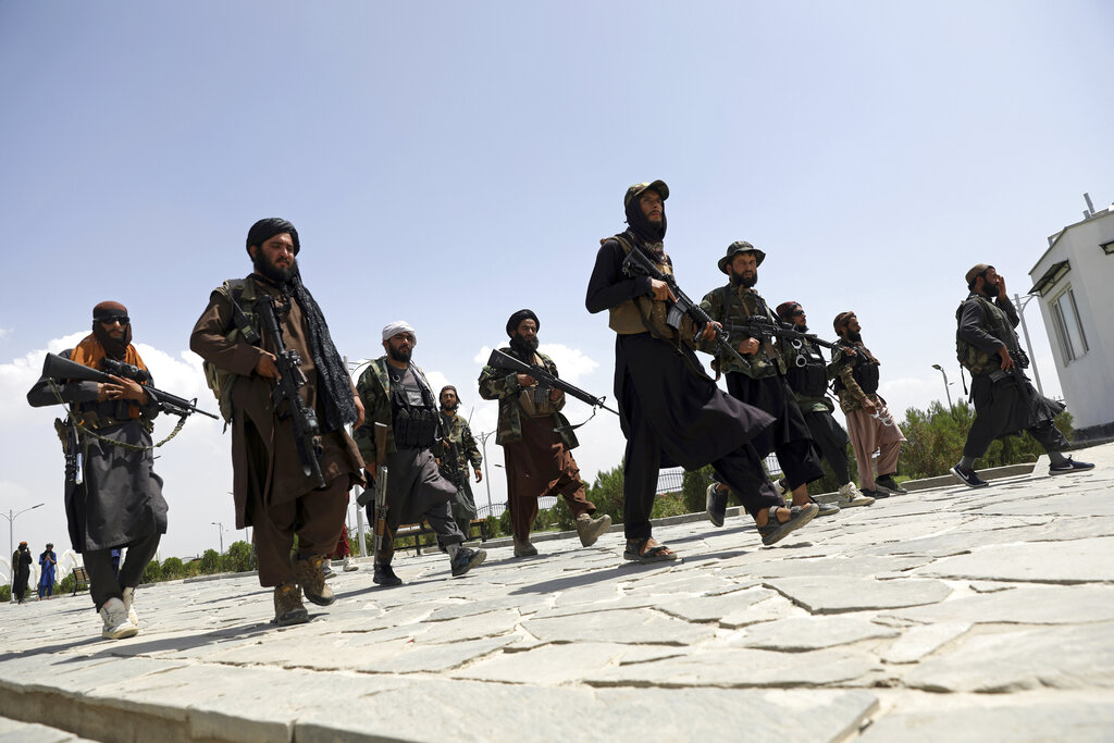 In this Aug. 19, 2021, file photo, Taliban fighters patrol in Kabul, Afghanistan. (AP Photo/Rahmat Gul, File)