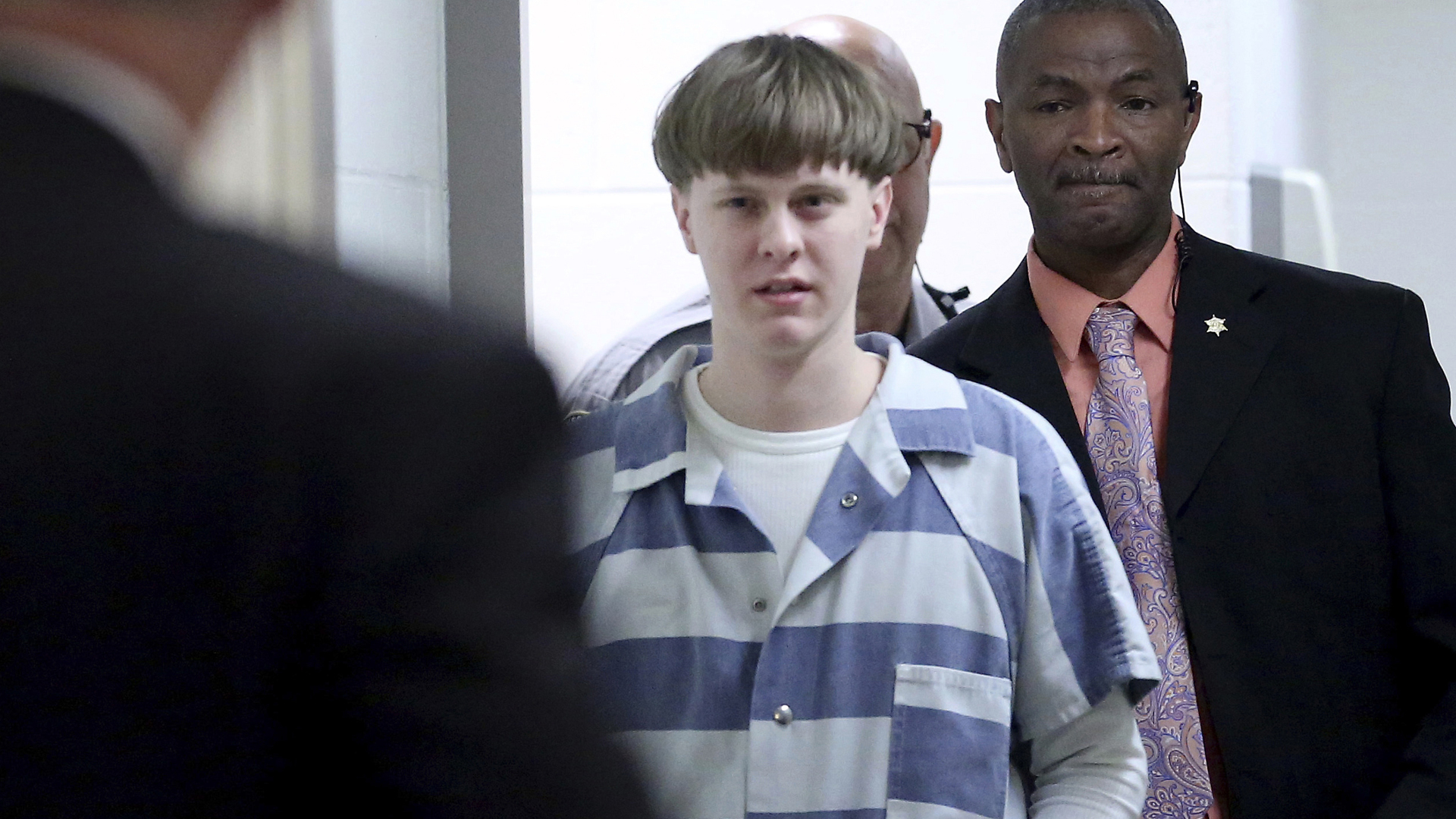 In this April 10, 2017, file photo, Dylann Roof enters the courtroom at the Charleston County Judicial Center to enter his guilty plea on murder charges in Charleston, S.C. (Grace Beahm/The Post And Courier via Associated Press, Pool)