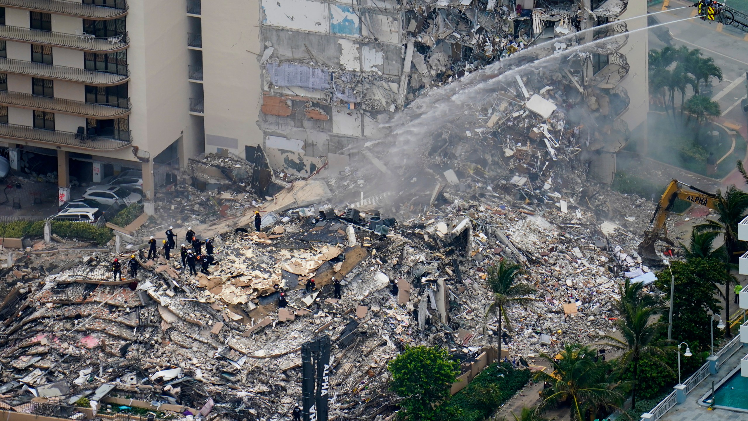 Rescue crews work in the rubble at the Champlain Towers South Condo in Surfside, Fla., in this Friday, June 25, 2021, file photo. (AP Photo/Gerald Herbert, File)