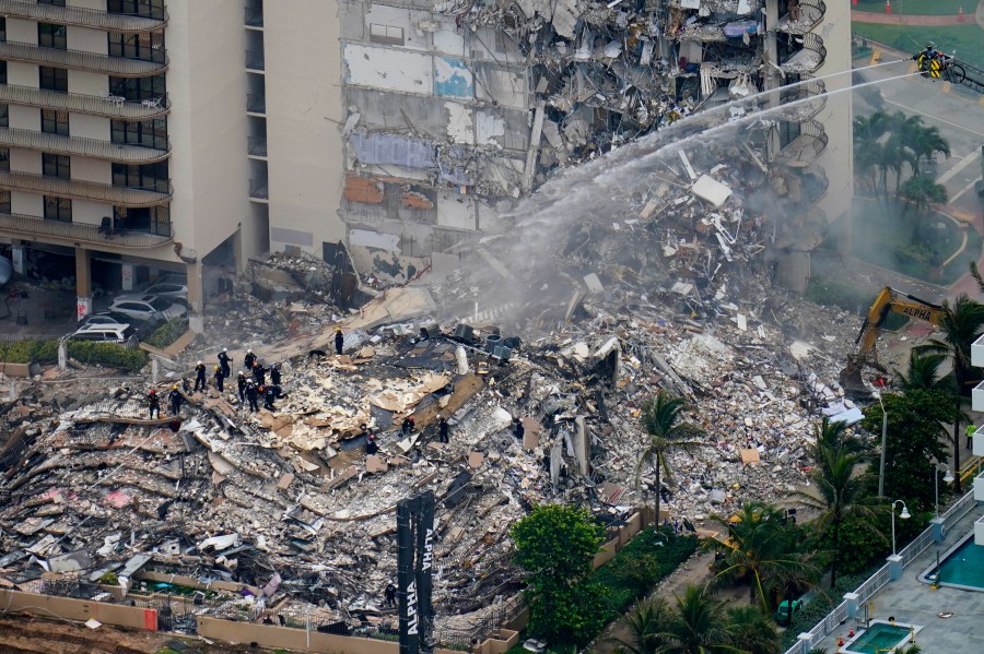 Rescue crews work in the rubble at the Champlain Towers South Condo in Surfside, Fla., in this Friday, June 25, 2021, file photo. (AP Photo/Gerald Herbert, File)