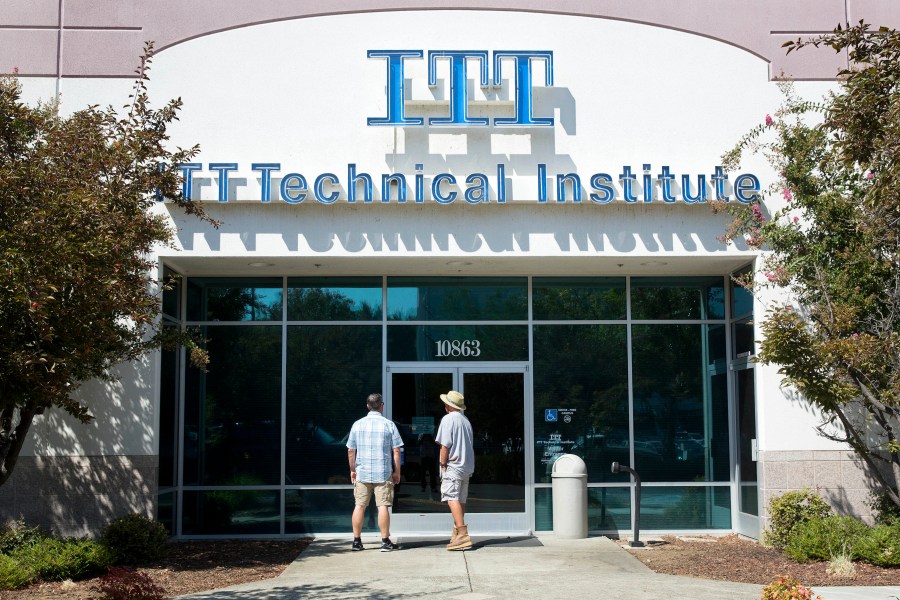 In this Sept. 6, 2016, file photo students find the doors locked to the ITT Technical Institute campus in Rancho Cordova, Calif. The U.S. Education Department announced Thursday, Aug. 26, 2021, it will forgive student debt for more than 100,000 borrowers who attended the now-defunct ITT Technical Institute chain but left before graduating. (AP Photo/Rich Pedroncelli, File)