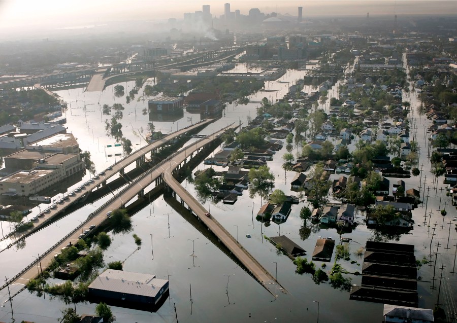 In this Aug. 30, 2005 file photo, Floodwaters from Hurricane Katrina fill the streets near downtown New Orleans. Hurricane Ida looks an awful lot like Hurricane Katrina, bearing down on the same part of Louisiana on the same calendar date. But hurricane experts say there are differences in the two storms 16 years apart that may prove key and may make Ida nastier in some ways but less dangerous in others.(AP Photo/David J. Phillip, File)