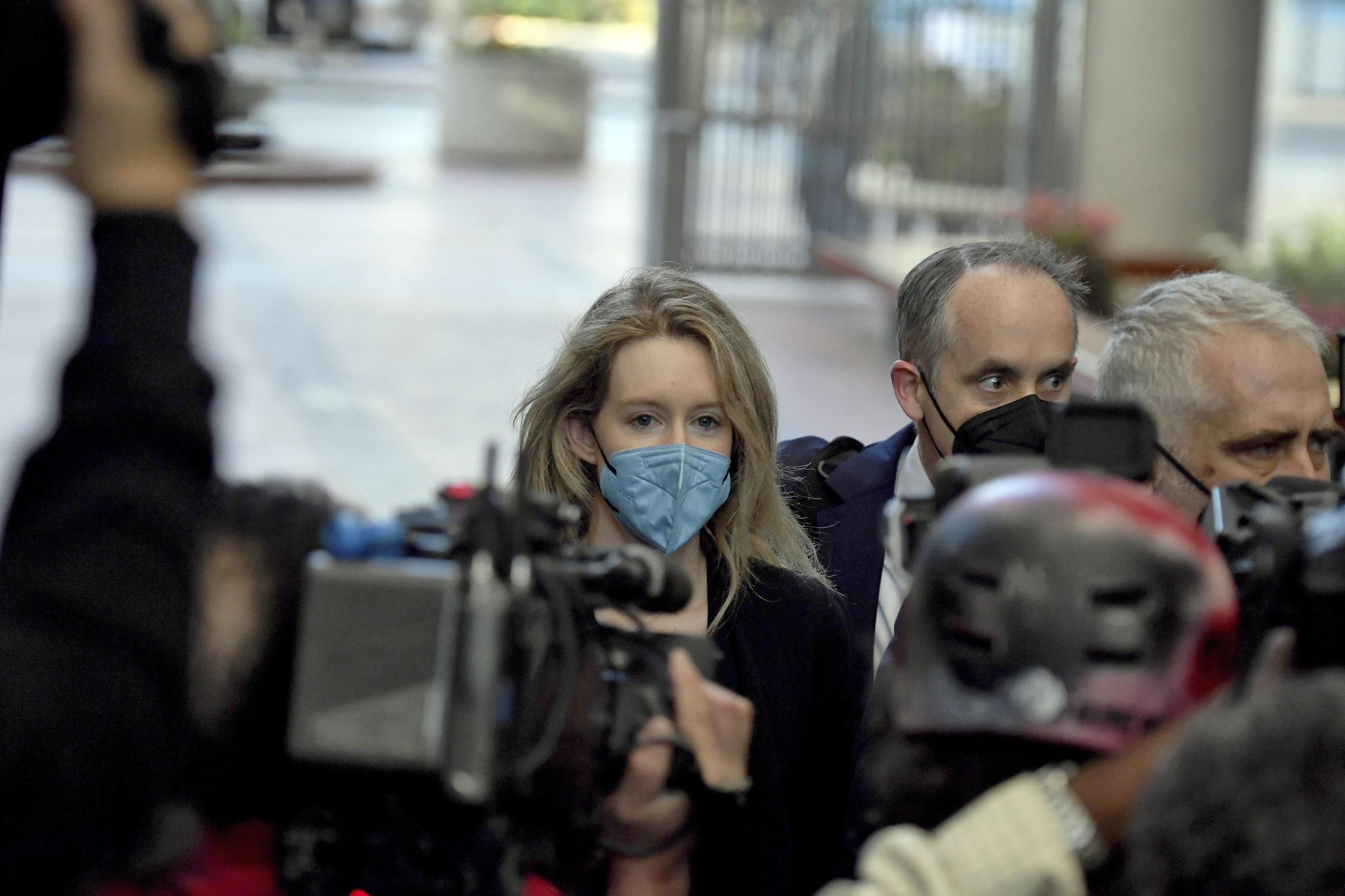 Elizabeth Holmes, founder and CEO of Theranos, arrives at the federal courthouse for jury selection in her trial in San Jose on Aug. 31, 2021. (Nic Coury/Associated Press)