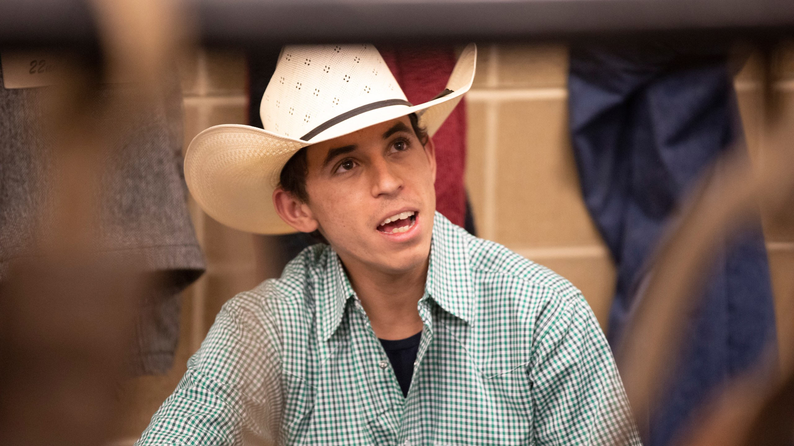 Bull rider Amadeu Campos Silva speaks in a locker room in Bangor, Maine, in March 2020. The Brazilian bull rider was killed Sunday, Aug. 29, 2021, when his spur got caught in a rope, pulling him under the bull, and the animal stepped on his chest in California, according to the Professional Bull Riders touring group. Silva, 22, was competing at a bull-riding Velocity Tour event at the Save Mart Center in Fresno, said Andrew Giangola, a spokesperson for Professional Bull Riders. He was pronounced dead at a hospital. (Andre Silva/Courtesy PBR/Bull Stock Media via AP)