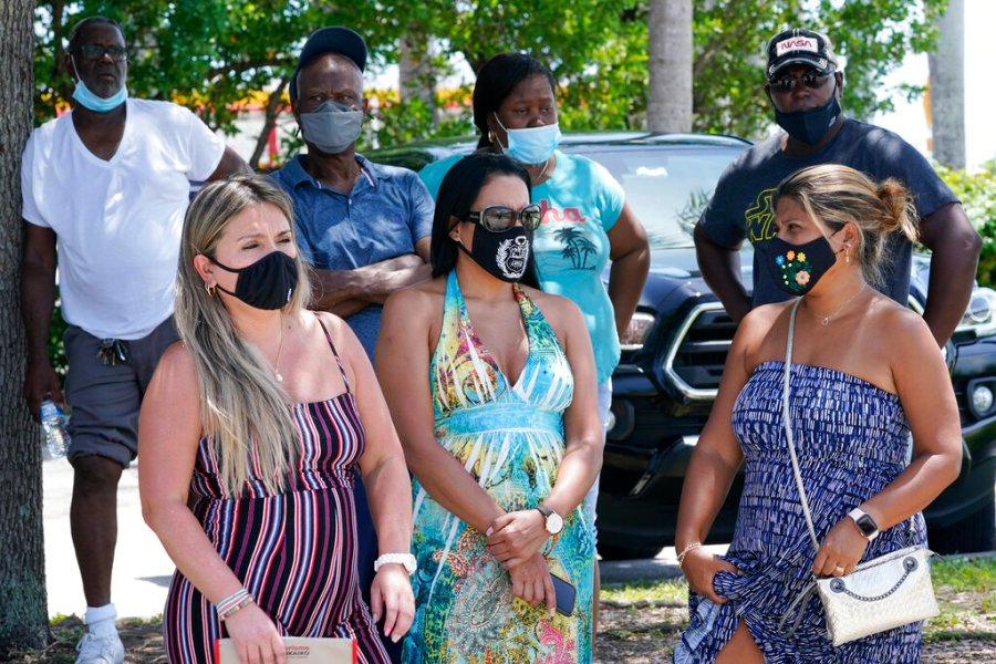 A group waits to get a COVID-19 test in North Miami, Fla. The state has become the new national epicenter for the virus, accounting for around a fifth of all new cases in the U.S. Florida Gov. Ron DeSantis has resisted mandatory mask mandates and vaccine. (AP Photo/Marta Lavandier)