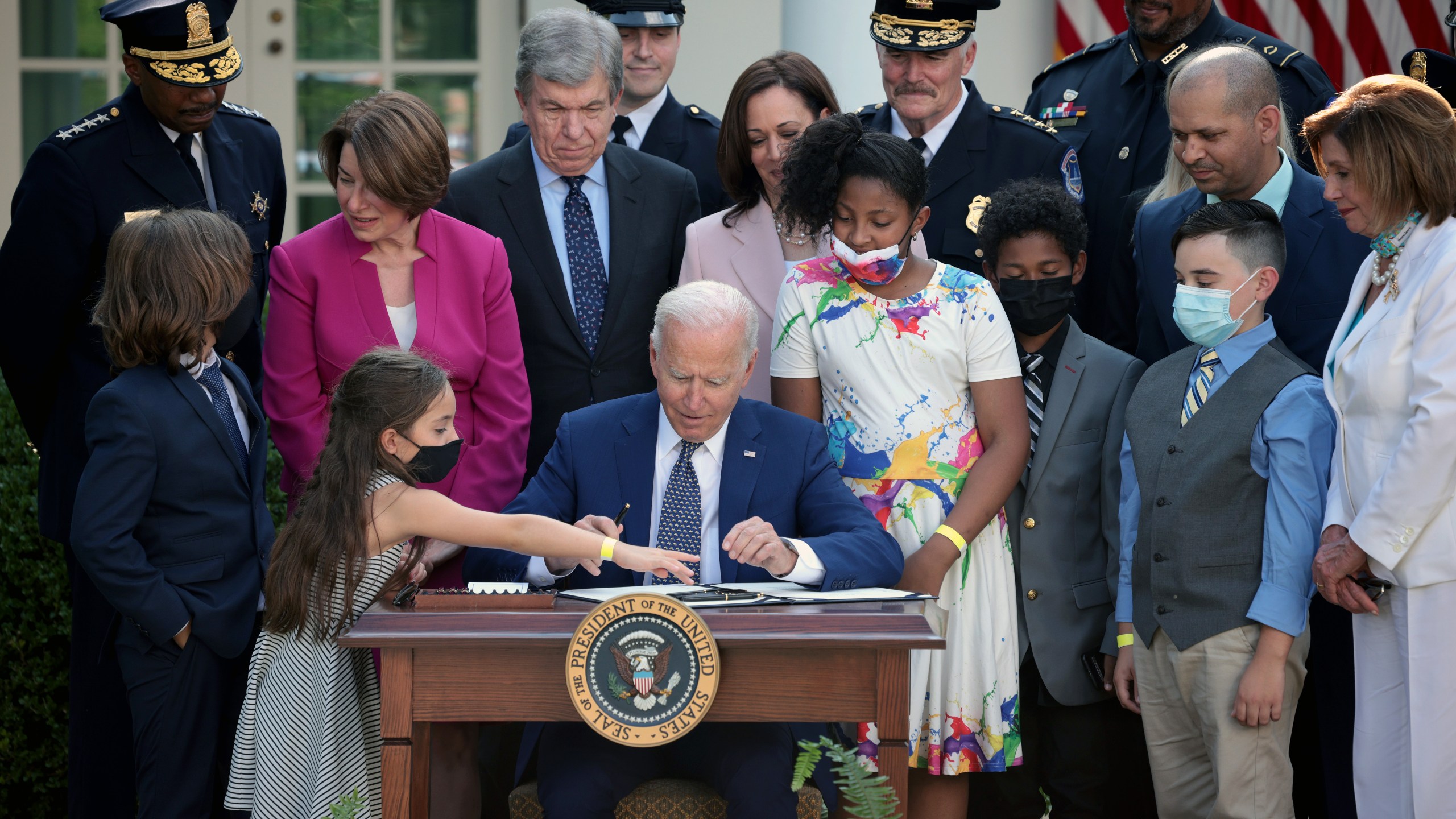 President Joe Biden, joined by lawmakers and members of law enforcement and their families, signs legislation to award congressional gold medals to law enforcement in the Rose Garden of the White House on August 5, 2021 in Washington, DC. Biden spoke before signing H.R. 3325, legislation to award four congressional gold medals to the United States Capitol Police and those who protected the U.S. Capitol on January 6, 2021. (Win McNamee/Getty Images)