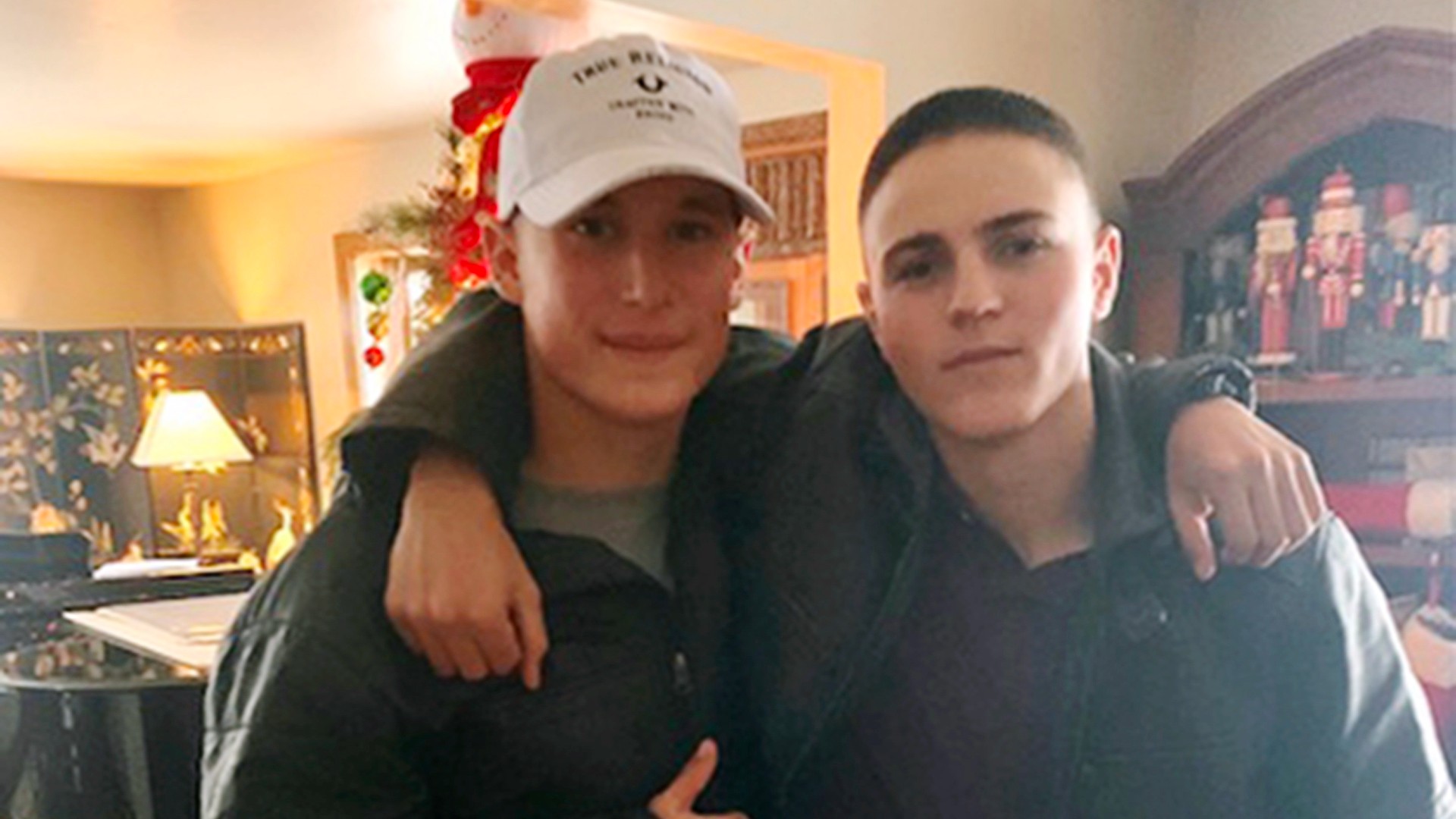 This Dec. 2019, photo provided by Regi Stone shows Eli Stone, left, and Rylee McCollum, at Christmas in Stone's house in Jackson, Wyo. Rylee McCollum, of Bondurant, Wyo., was one of the U.S. Marines killed in the suicide bombing at the Kabul airport, in Afghanistan, according to his sister, Roice McCollum. (Regi Stone via AP)