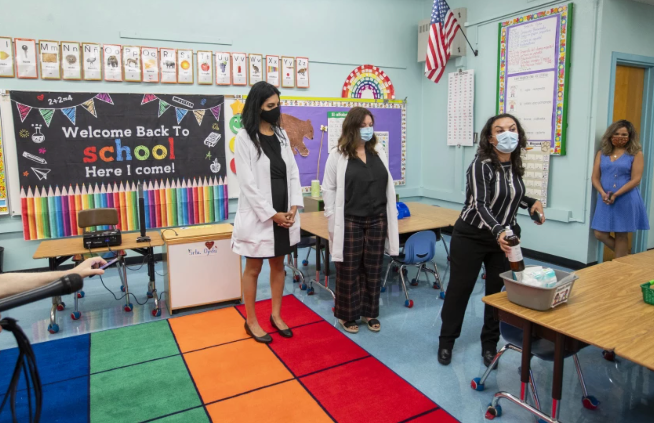 Dr. Smita Malhotra, left, Dr. Rosina Franco and Principal Josefina Flores go over COVID-19 safety measures at Euclid Avenue Elementary School in Boyle Heights in late July, 2021.(Allen J. Schaben / Los Angeles Times)