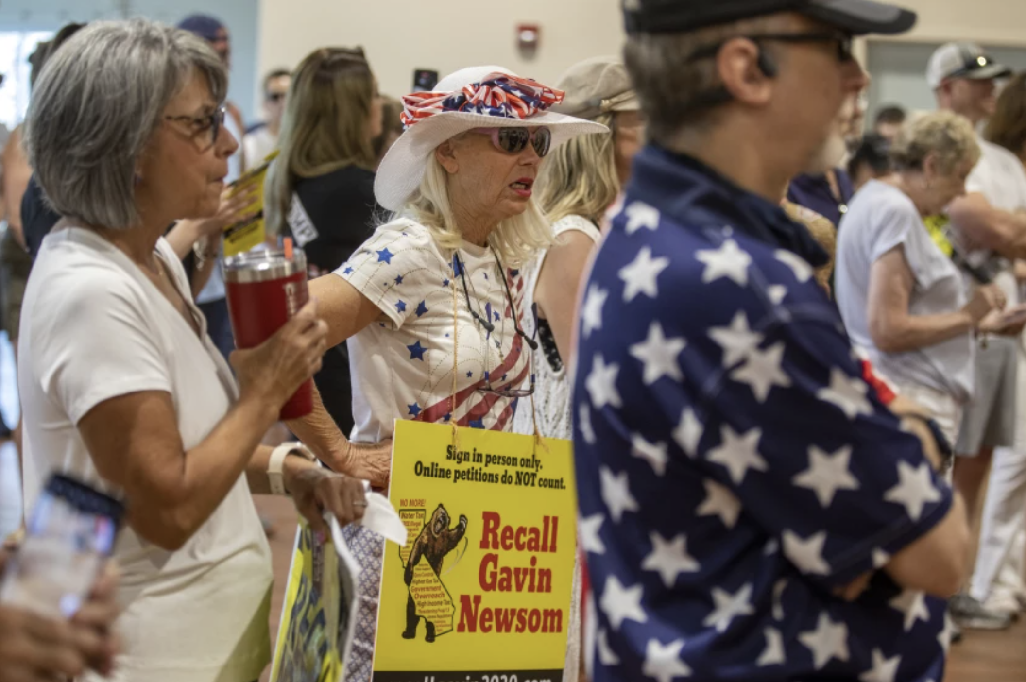 Vicky Abramson, center, of Valencia attends a Newsom recall rally at the Santa Clarita Activities Center on Aug. 15 in Santa Clarita.(Francine Orr / Los Angeles Times)