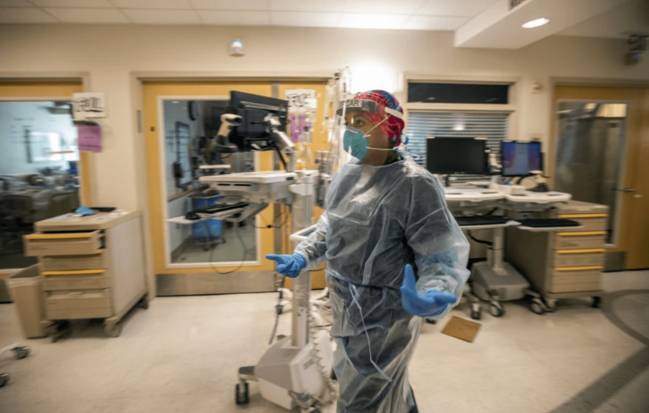 Dr. Anita Sircar hurries through the cover unit inside Little Company of Mary Medical Center in Torrance in August 2021.(Francine Orr / Los Angeles Times)