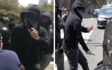 Police think a black-clad man stabbed another man at a protest on Aug. 14, 2021. (LAPD)