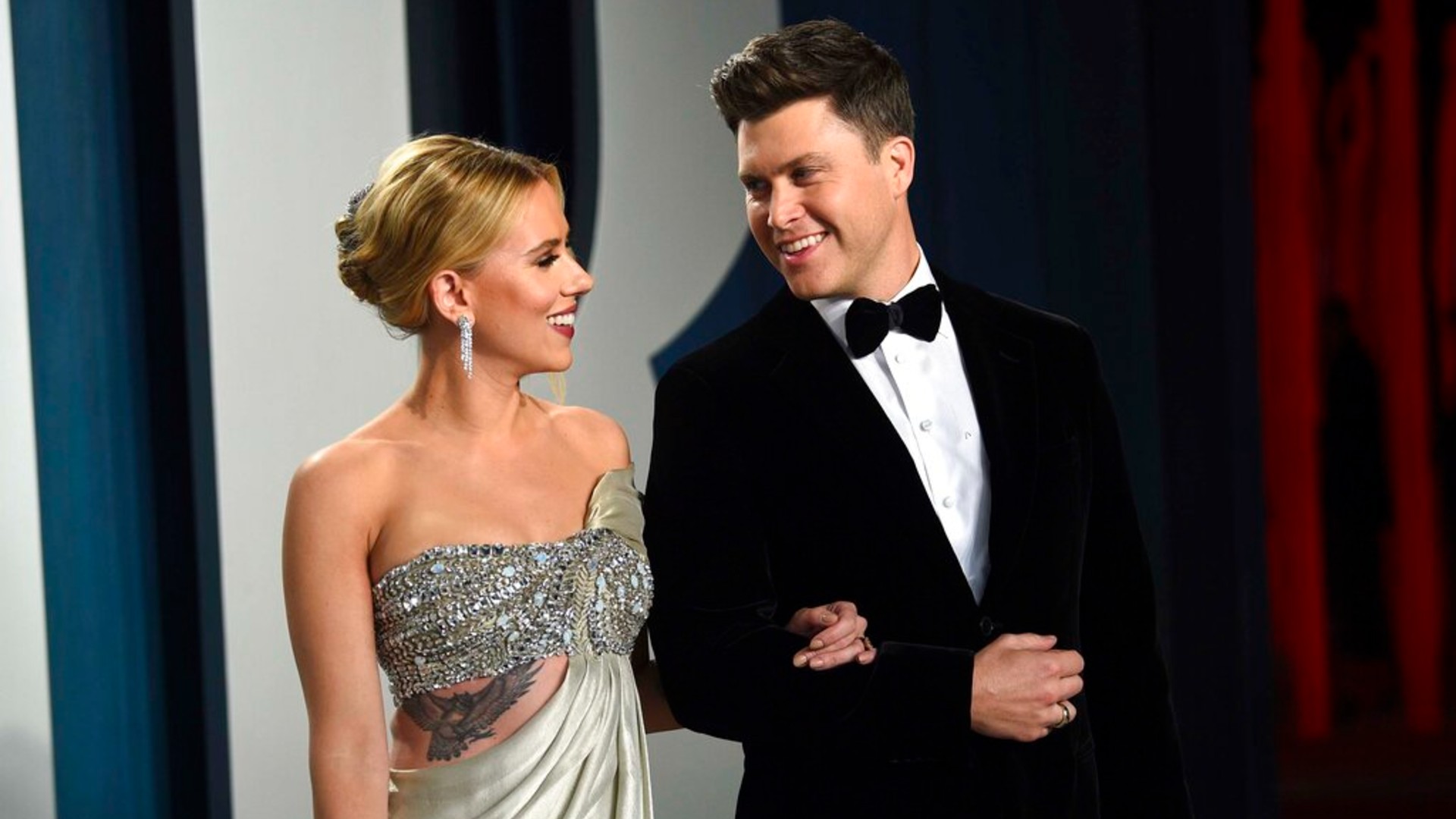 In this Feb. 9, 2020 file photo, Scarlett Johansson, left, and Colin Jost arrive at the Vanity Fair Oscar Party in Beverly Hills, Calif. (Photo by Evan Agostini/Invision/AP, File)