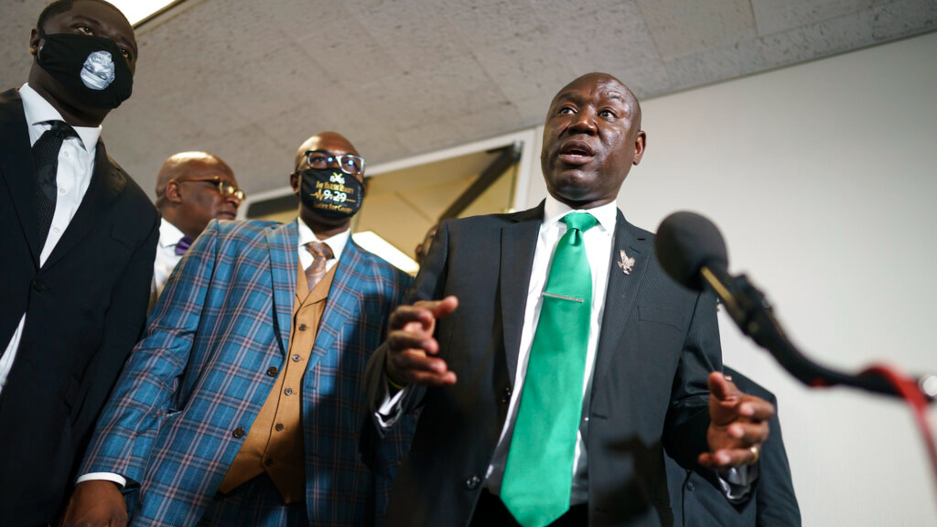 In this May 25, 2021, file photo, Ben Crump, center, the civil rights attorney representing the family of George Floyd, speaks to reporters after they met with Sen. Cory Booker, D-N.J., about police reform legislation, at the Capitol in Washington. (AP Photo/J. Scott Applewhite, File)