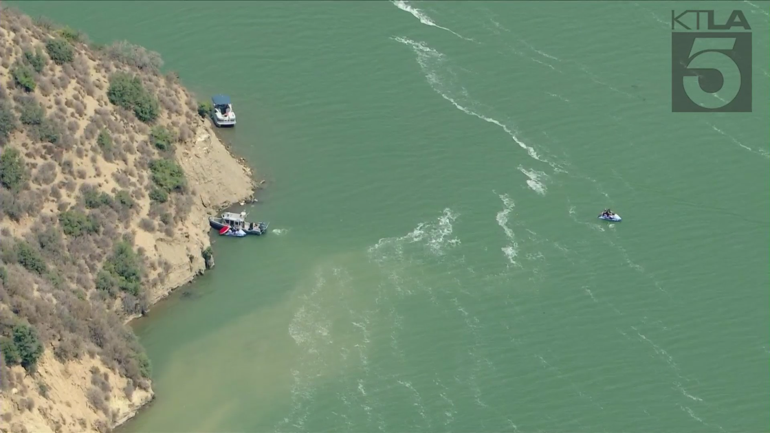 Divers search for a person who fell off a boat in Pyramid Lake on Aug. 16, 2021. (KTLA)