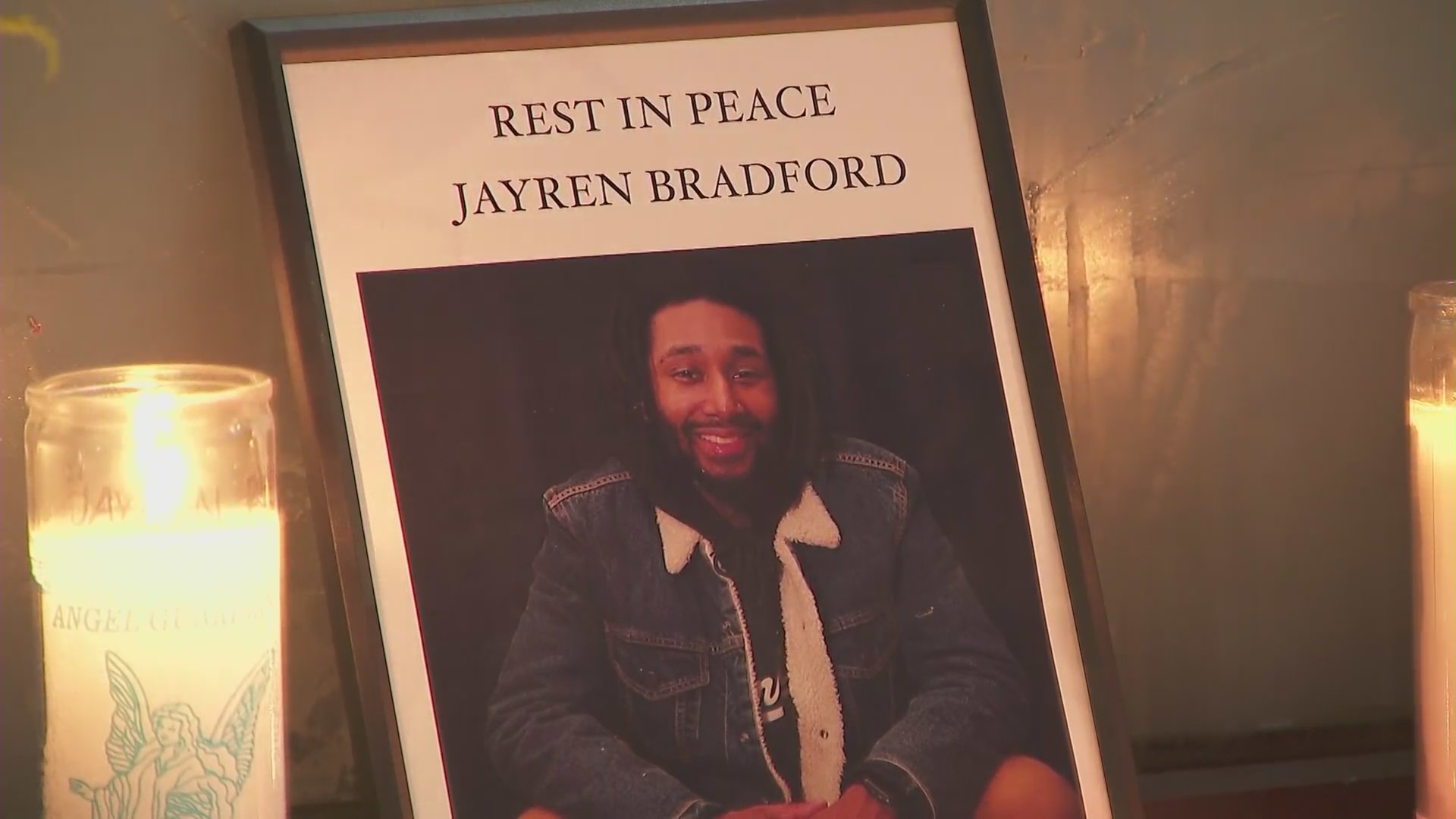 Jayren Bradford is seen in a photo left at a memorial outside the Shoe Palace in the Fairfax district where he worked and was fatally shot on Aug. 11, 2021. (KTLA)