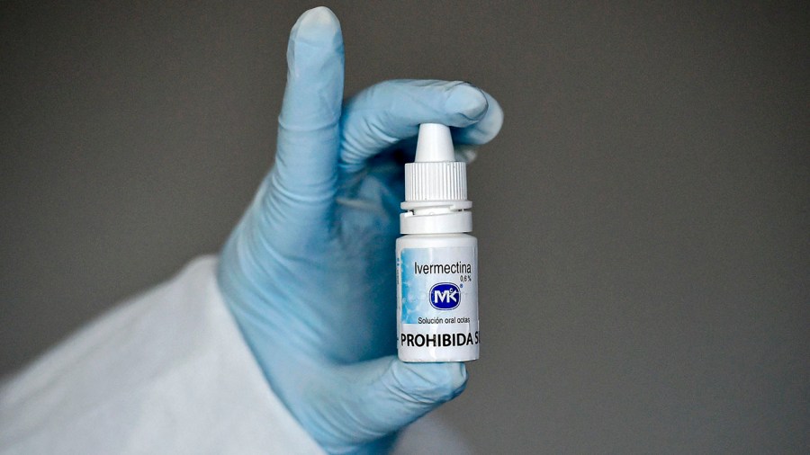 A health worker shows a bottle of ivermectin in Cali, Colombia, on July 21, 2020. (LUIS ROBAYO/AFP via Getty Images)