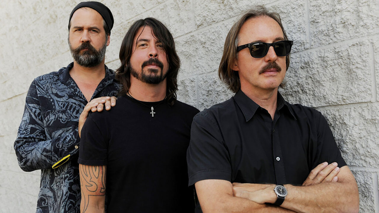 Krist Novoselic, left, and Dave Grohl, center, former members of the band Nirvana, pose with Butch Vig, producer of the band's landmark 1991 album "Nevermind," Tuesday, Sept. 6, 2011, in Los Angeles. (AP Photo/Chris Pizzello)