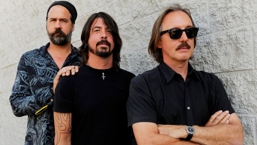 Krist Novoselic, left, and Dave Grohl, center, former members of the band Nirvana, pose with Butch Vig, producer of the band's landmark 1991 album "Nevermind," Tuesday, Sept. 6, 2011, in Los Angeles. (AP Photo/Chris Pizzello)