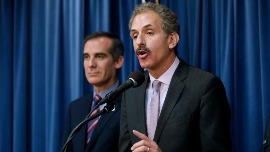 Los Angeles City Atty. Mike Feuer, standing alongside Mayor Eric Garcetti, is one of only two elected officials currently running for mayor in 2022.(Gary Coronado/Los Angeles Times)