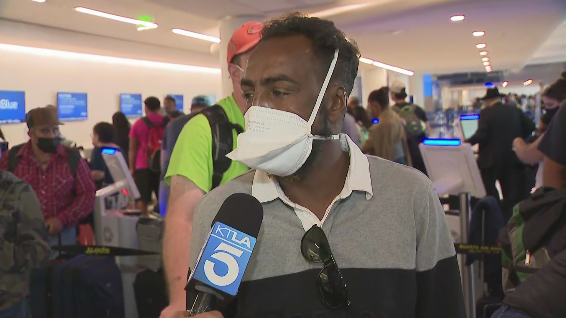 A man waiting to talk to a Spirit Airlines representative on Aug. 3, 2021, says he's been waiting two days for a flight out of LAX. (KTLA)