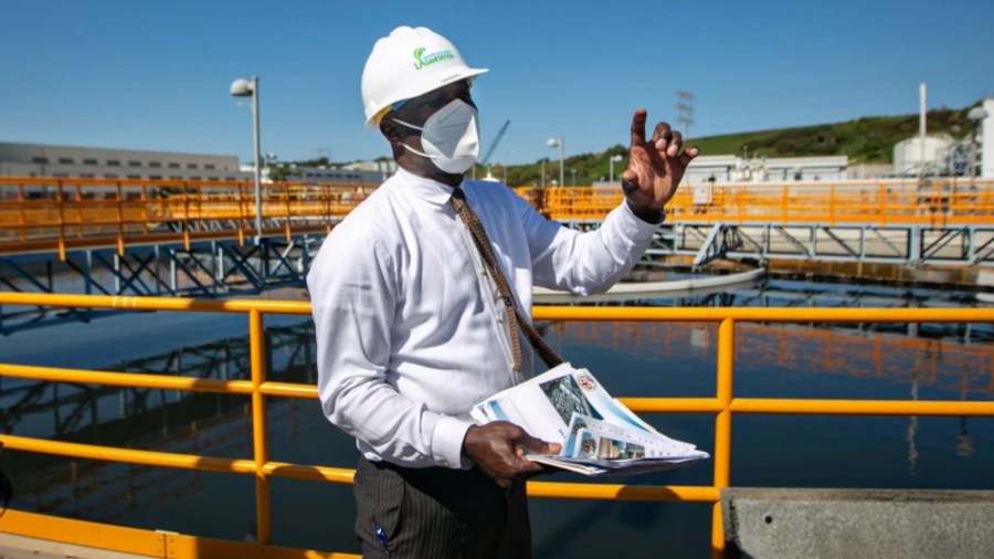 Timeyin Dafeta, executive manager of the Hyperion Water Reclamation Plant, speaks to reporters recently during a tour of the plant. (Jason Armond / Los Angeles Times)