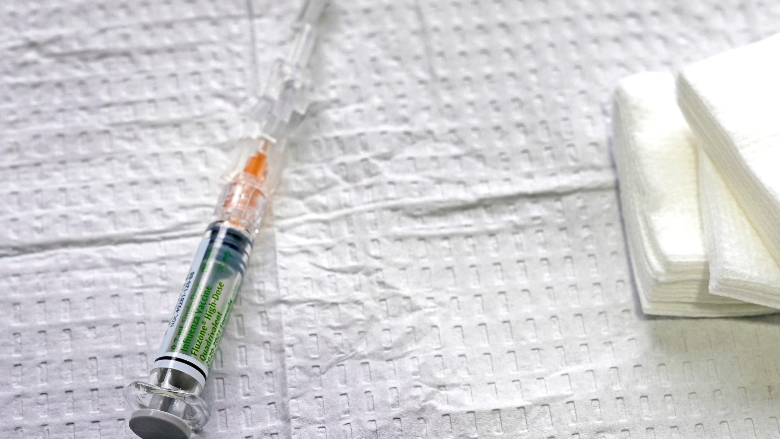 A syringe of high-dose flu vaccine typically given to people over the age of 65 is shown on Oct. 15, 2020. (AP Photo/Ted S. Warren)