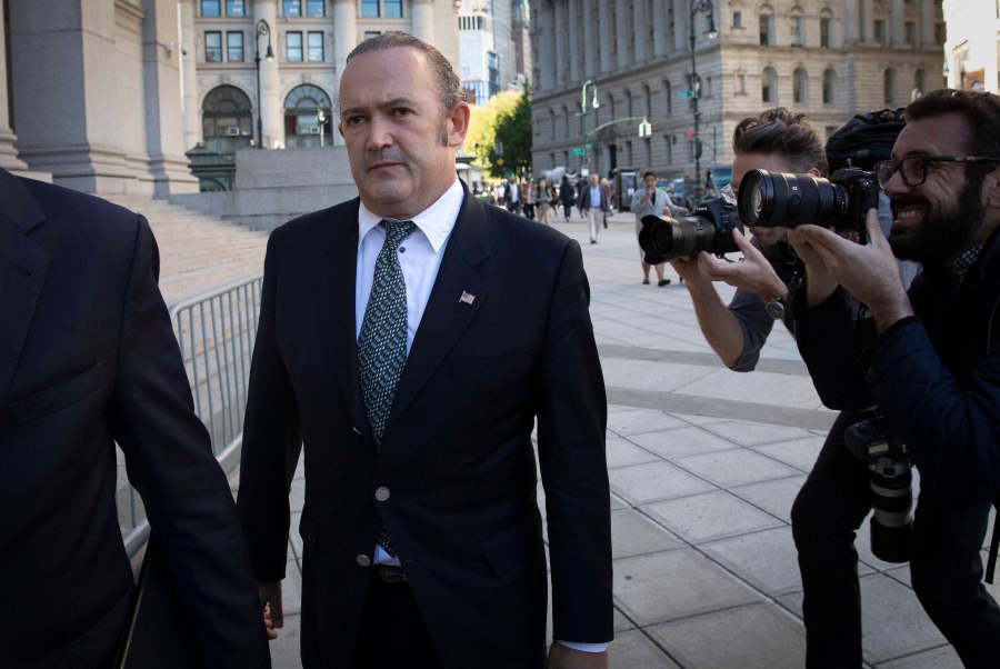 In this Oct. 23, 2019 file photo, Igor Fruman, left, arrives for his arraignment in New York. U.S. (AP Photo/Mark Lennihan, File)