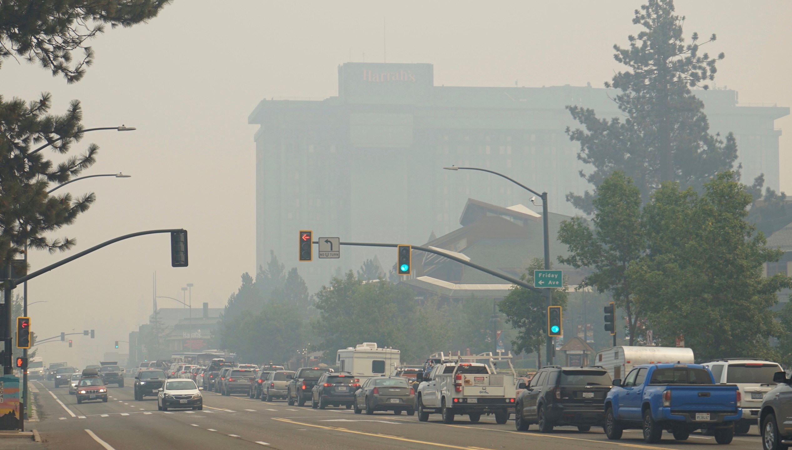 In this Aug. 30, 2021, file photo, vehicles idle in bumper-to-bumper traffic after a wildfire evacuation order in South Lake Tahoe, Calif. The threat the Caldor Fire poses to Lake Tahoe residents is exposing differences between laws against price-gouging in Nevada and California. Evacuees are reporting rideshare companies quoting trips from area ski resorts to the Reno-Tahoe International Airport at eight times the normal rate and hotels on the Nevada side of the resort town hiked room rates to $449 per night on Tuesday, Aug. 31, 2021. (AP Photo/Sam Metz, File)