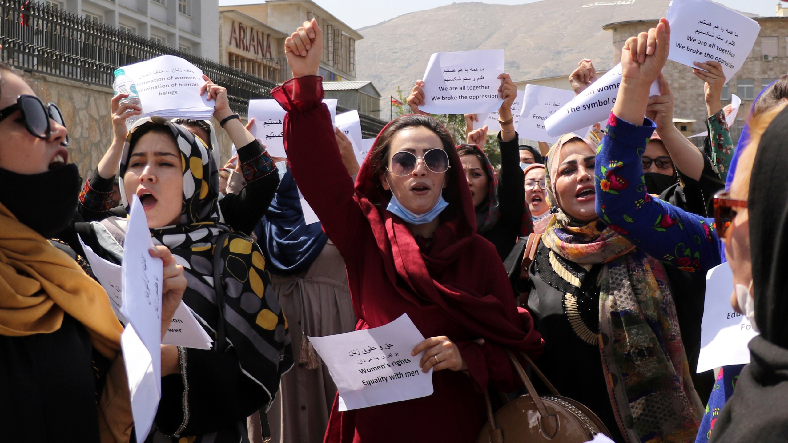 Women gather to demand their rights under the Taliban rule during a protest in Kabul, Afghanistan, Friday, Sept. 3, 2021. As the world watches intently for clues on how the Taliban will govern, their treatment of the media will be a key indicator, along with their policies toward women. When they ruled Afghanistan between 1996-2001, they enforced a harsh interpretation of Islam, barring girls and women from schools and public life, and brutally suppressing dissent. (AP Photo/Wali Sabawoon)