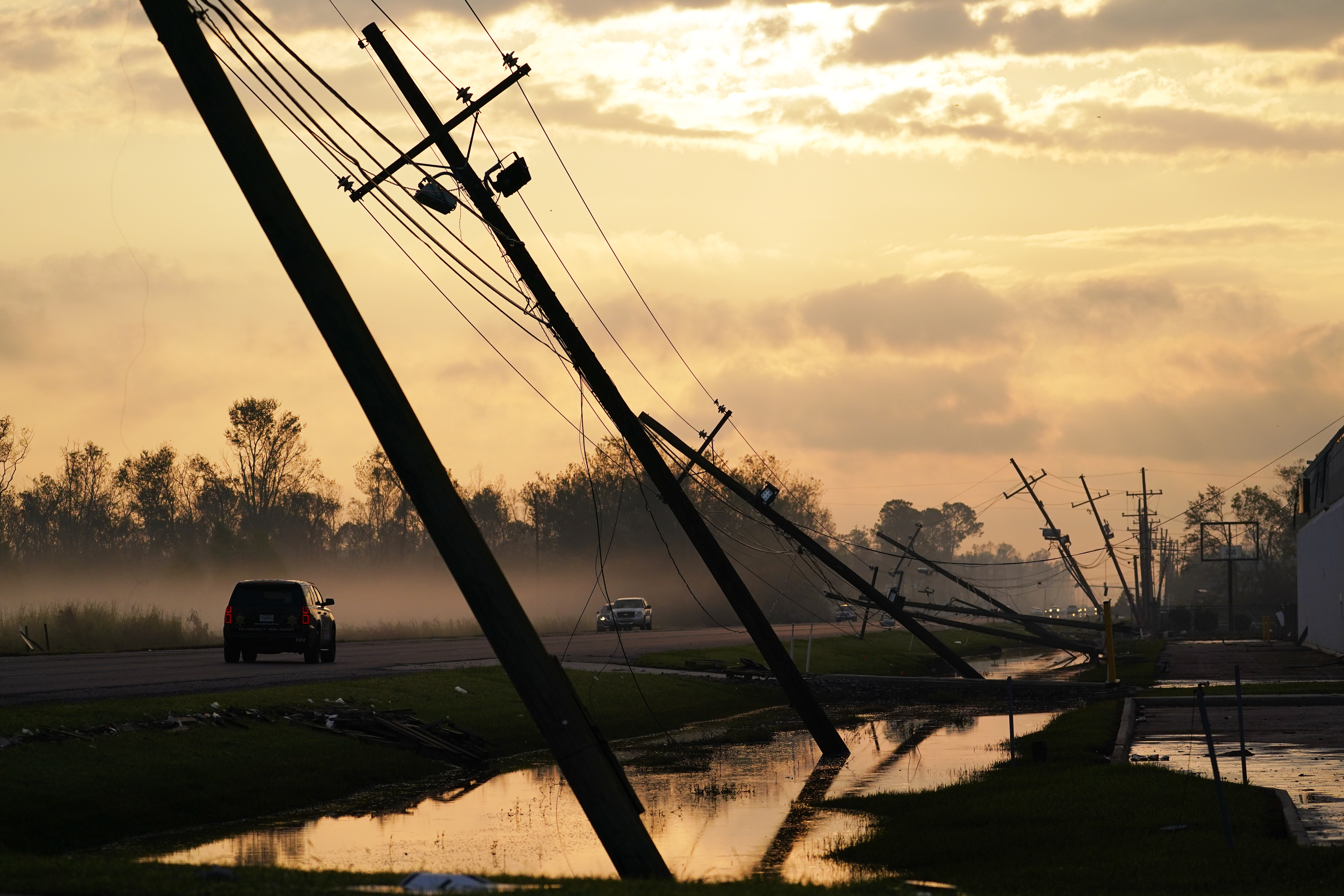 Downed power lines slump over a road in the aftermath of Hurricane Ida Sept. 3, 2021, in Reserve, Louisiana. (Matt Slocum/Associated Press)