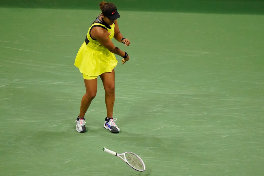 Naomi Osaka, of Japan, throws her racket down during a match against Leylah Fernandez, of Canada, at the third round of the US Open tennis championships, on Sept. 3, 2021, in New York. (Frank Franklin II/Associated Press)