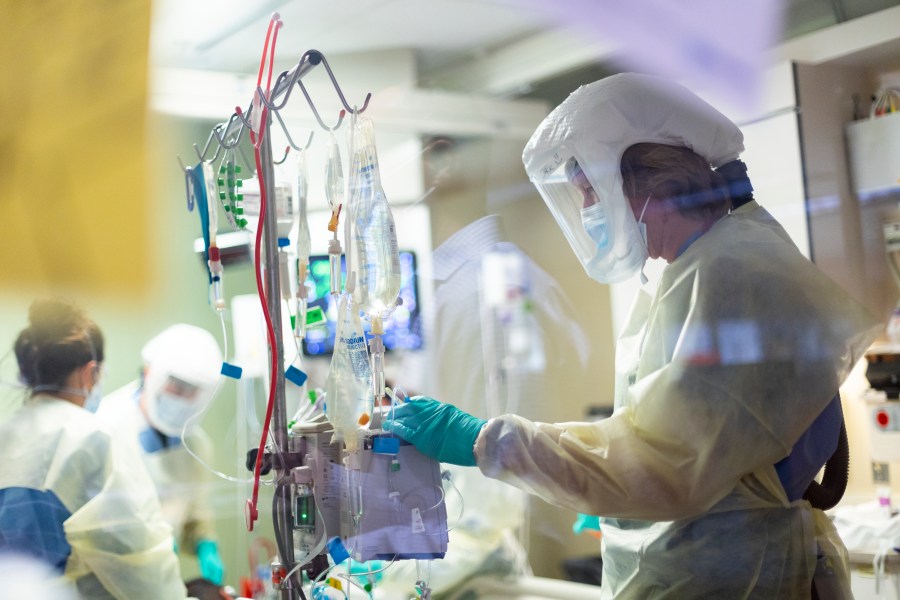 In this Aug. 31, 2021, file photo, Jack Kingsley R.N. attends to a COVID-19 patient in the Medical Intensive care unit at St. Luke's Boise Medical Center in Boise, Idaho. (Kyle Green/Associated Press)