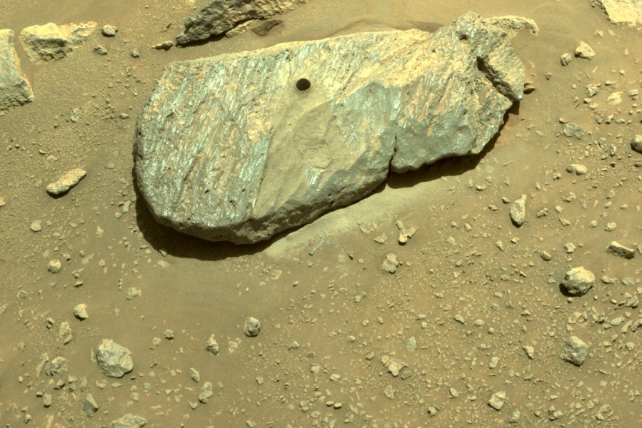 This Sept. 1, 2021 image provided by NASA shows the hole drilled by the Perseverance rover during its second sample-collection attempt in Mars' Jezero Crater. (NASA/JPL-Caltech via Associated Press)