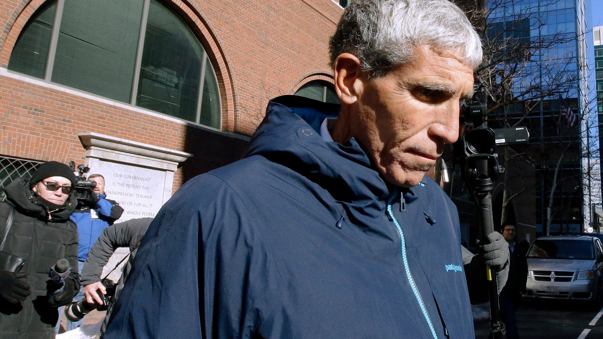 In this March 12, 2019 file photo, William "Rick" Singer founder of the Edge College & Career Network, departs federal court in Boston, after he pleaded guilty to charges in a nationwide college admissions bribery scandal. The first trial in the "Operation Varsity Blues" college admissions bribery scandal will begin this week, Wednesday, Sept. 8, 2021 with the potential to shed light on investigators' tactics and brighten the spotlight on a secretive school selection process many have long complained is rigged to favor the rich. (AP Photo/Steven Senne, File)