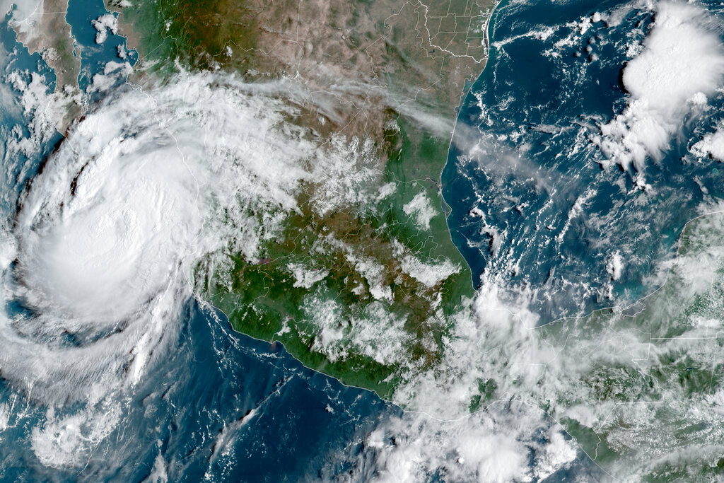 This satellite image provided by the National Oceanic and Atmospheric Administration shows Hurricane Olaf on the Pacific coast of Mexico approaching the Los Cabos resort region at the tip of the Baja California Peninsula, Thursday, Sept. 9, 2021. (NOAA/NESDIS/STAR GOES via AP)