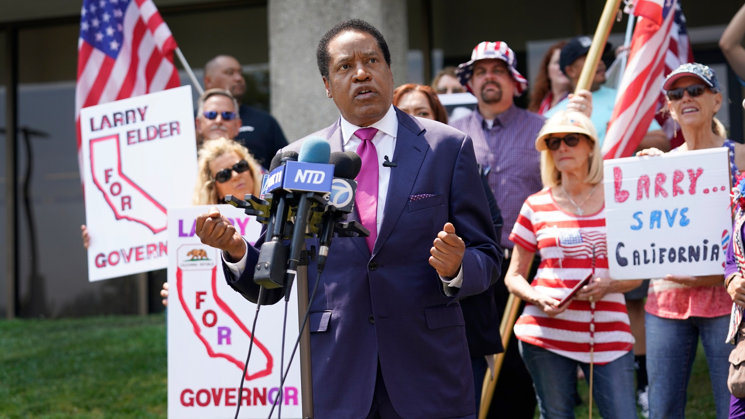 In this July 14, 2021, file photo, gubernatorial candidate and radio talk show host Larry Elder speaks to supporters during a campaign stop in Norwalk, Calif. In two short months, Larry Elder emerged from the province of conservative talk radio to dominate the Republican field in the California recall election that could remove Democratic Gov. Gavin Newsom from office, drawing national headlines, attracting fervent crowds to his rallies and quickly banking millions of dollars for his first campaign. (AP Photo/Marcio Jose Sanchez, File)