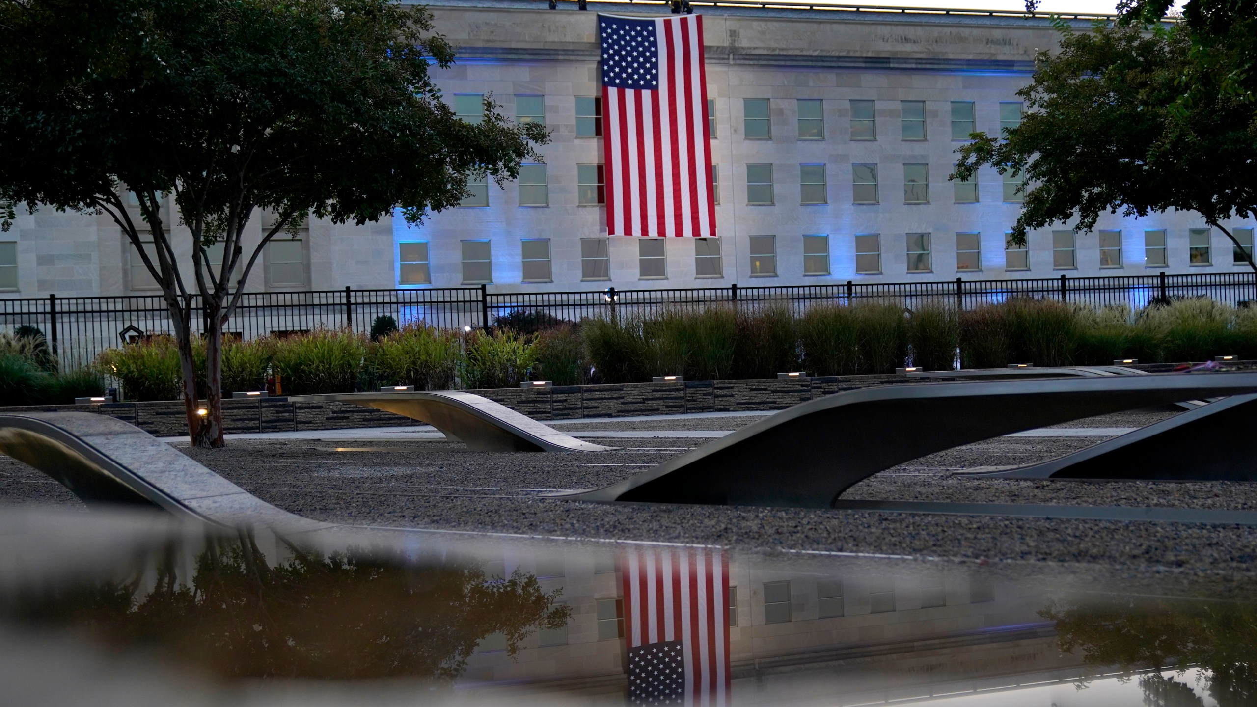 An American flag is unfurled at the Pentagon in Washington, Saturday, Sept. 11, 2021, at sunrise on the morning of the 20th anniversary of the terrorist attacks. (AP Photo/Alex Brandon)