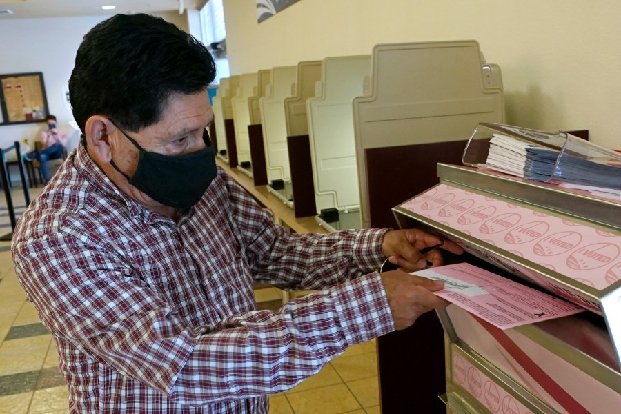 In this Aug. 30, 2021 file photo, Francisco Torres casts his ballot at the Sacramento County Registrar of Voters office in Sacramento, Calif. (AP Photo/Rich Pedroncelli, File)