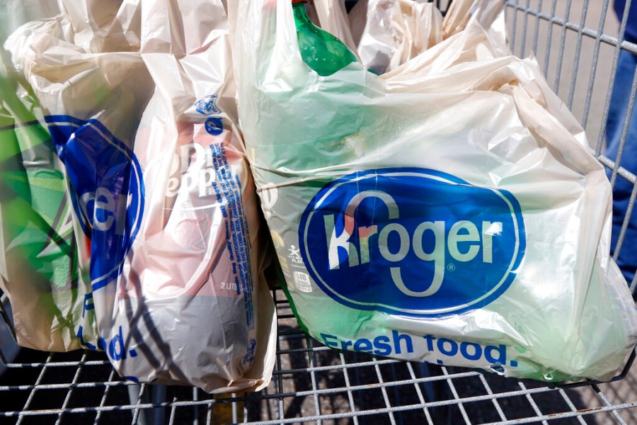 In this June 15, 2017, file photo, bagged purchases from the Kroger grocery store in Flowood, Miss., sit inside this shopping cart. Kroger is teaming up with Instacart on a new delivery service that can get grocery items to customers in as few as 30 minutes. (AP Photo/Rogelio V. Solis, File)